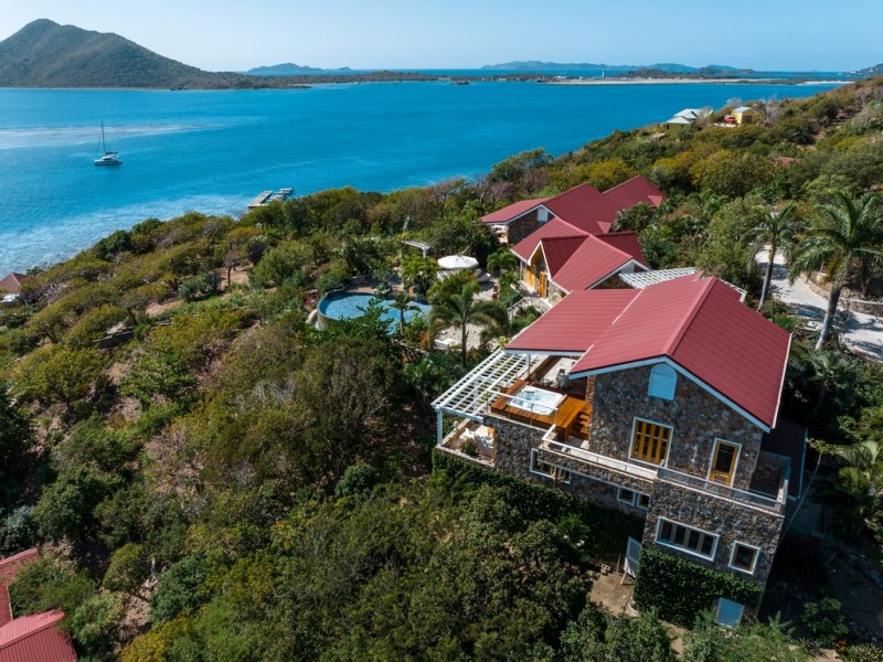 Aerial view of Diamond Reef Estate with pool and sea