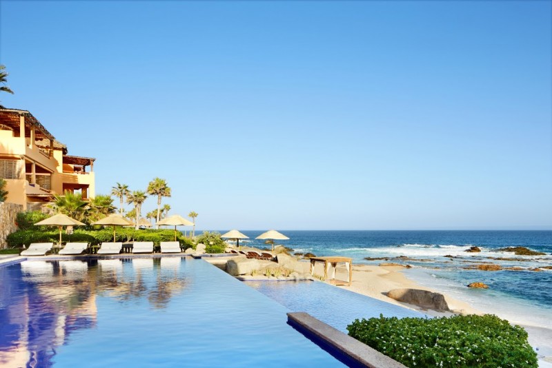 Outdoor infinity pool and the beautiful beach and sea views