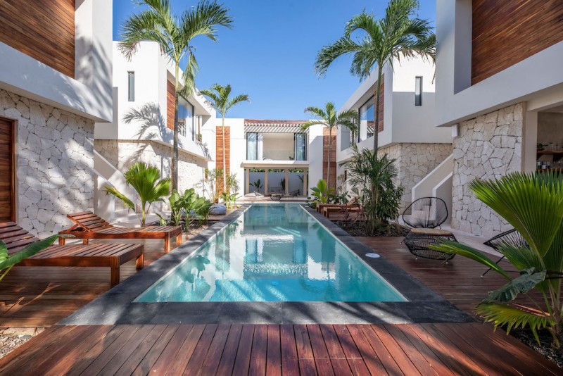 View of the main outdoor pool and surrounded terrace with pa