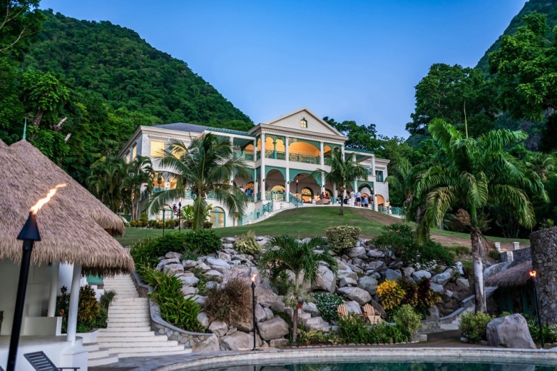 View of the villa on the slopes from the pool area