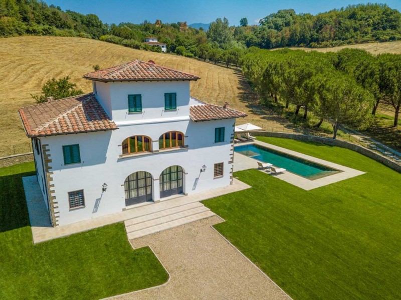 View of villa's stunning exterior and azure pool