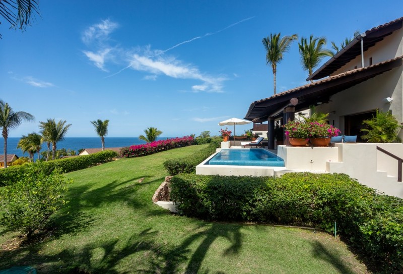 Pool area and garden at Villa Riva in Punta Mita
