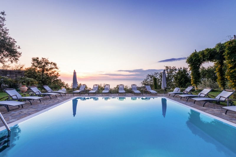 view of pool and sea
