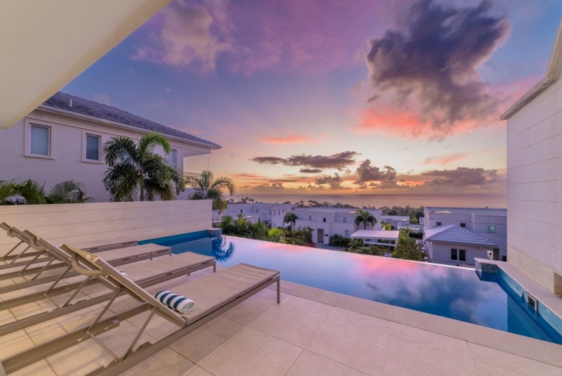 View of the pool area at sundown at Sundowner Villa