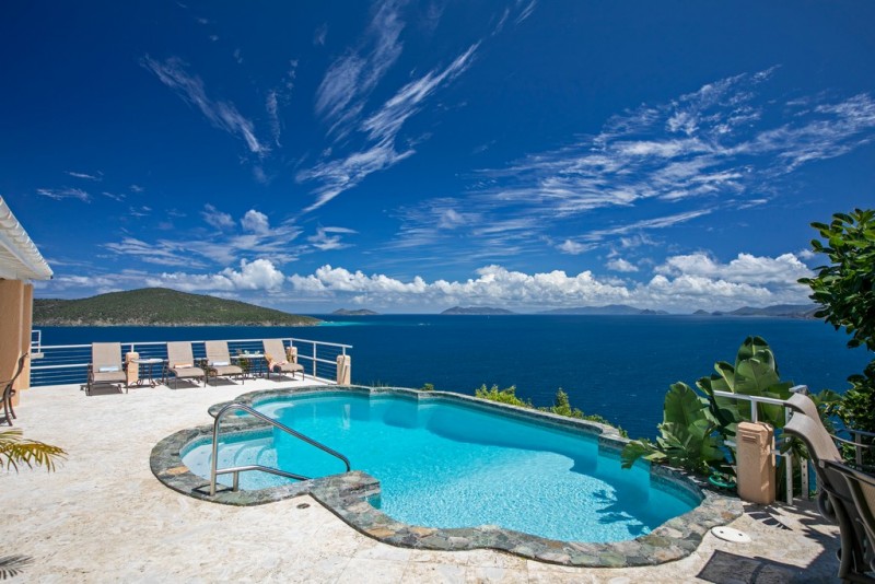 pool with sea in the background