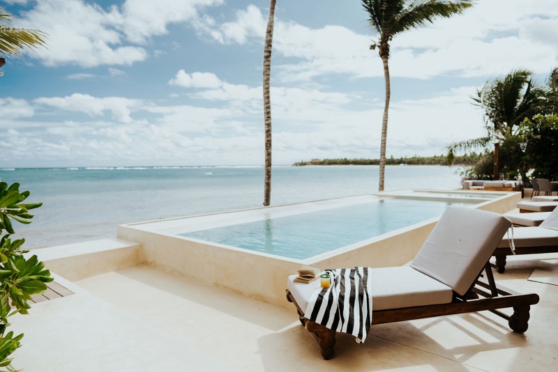 view of pool with beach in the background
