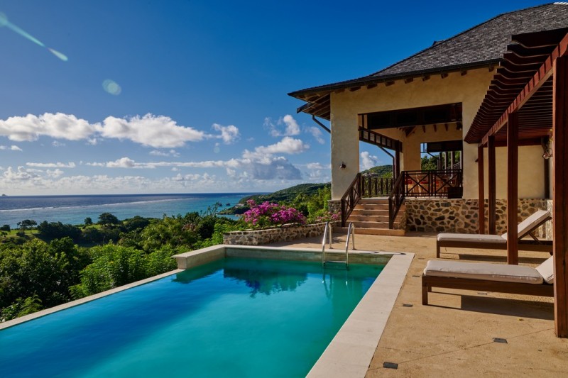 Pool Terrace with views from Villamia at Canouan Resort