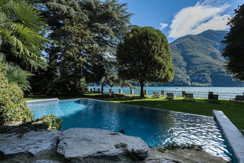 view of villa with lake  in the background
