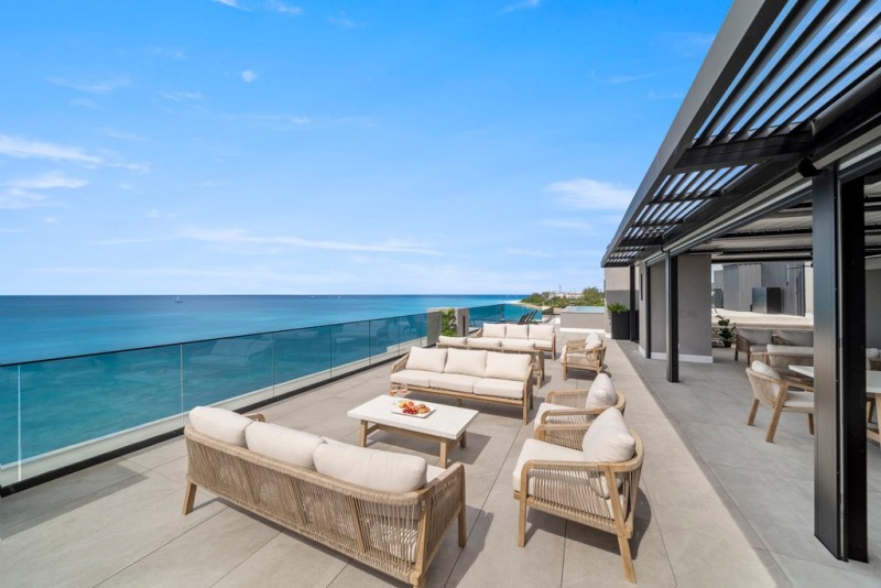 View of balcony with ocean in the background