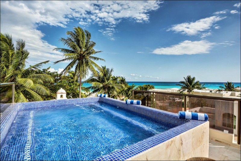 View of Pool with sea in the background