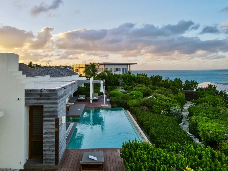 view of villa with sea in the background