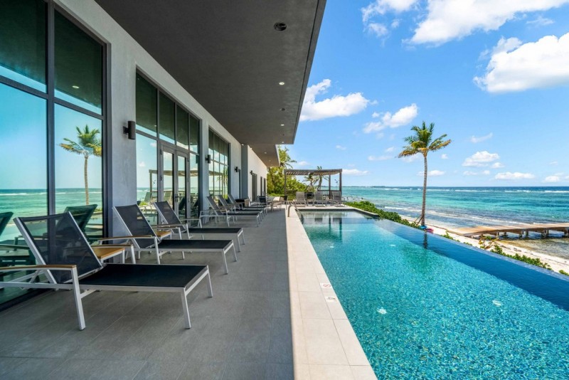 View of Pool with sea in the background