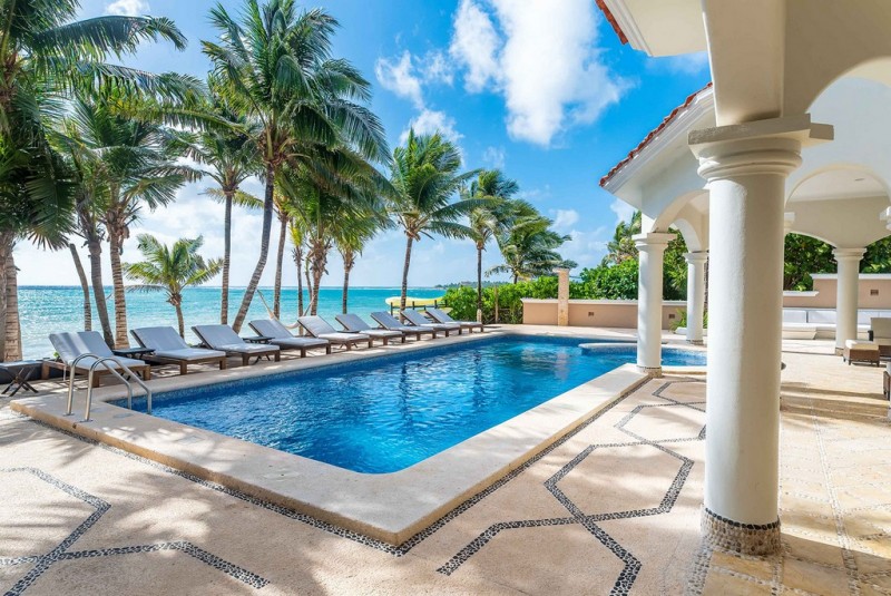 View of Pool with sea in the background