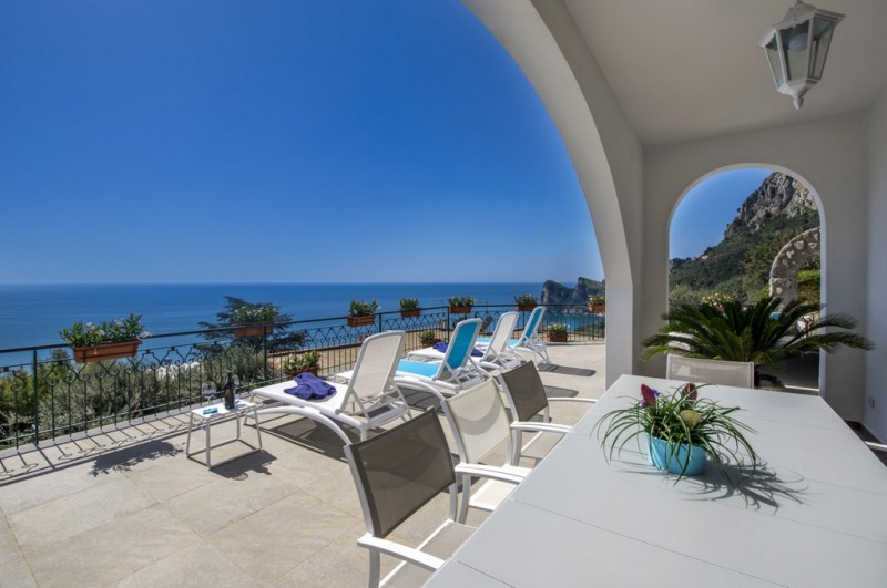 view of villa with sea in the background