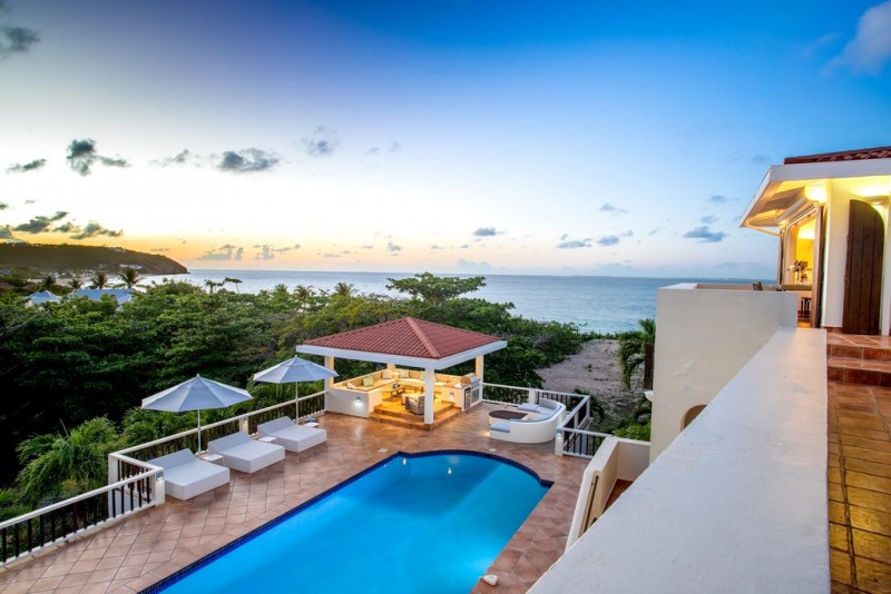 View of Pool with sea in the background