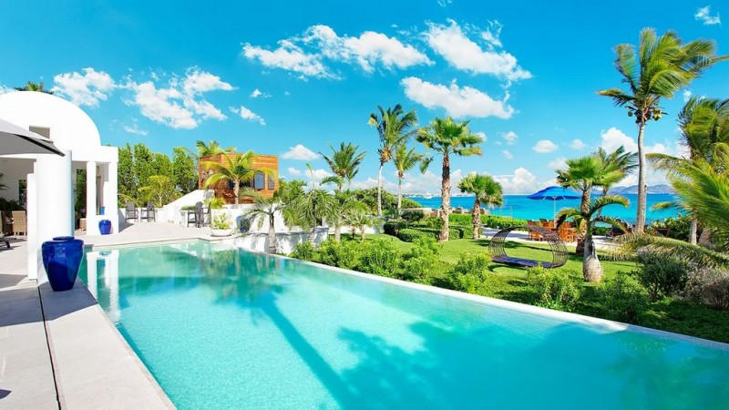 View of Pool with sea in the background