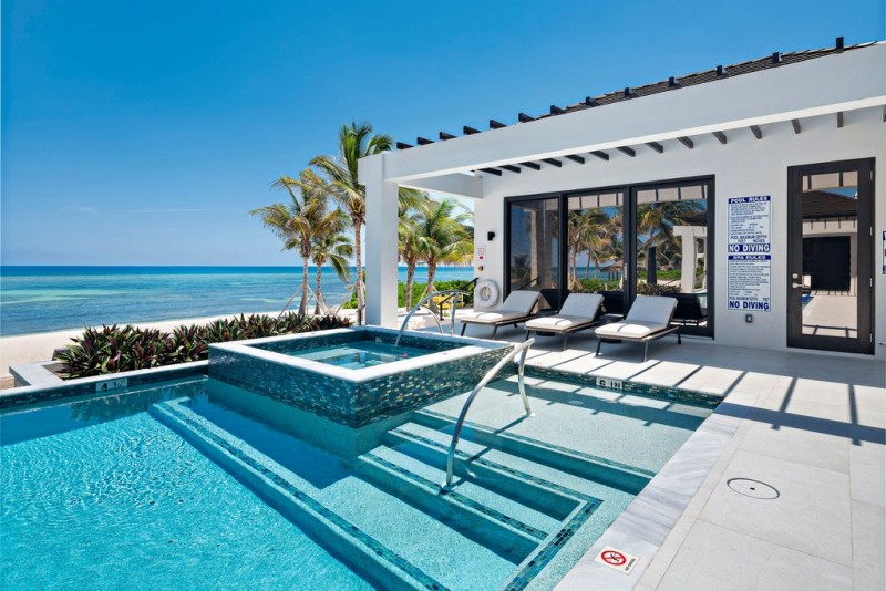 View of Pool with sea in the background