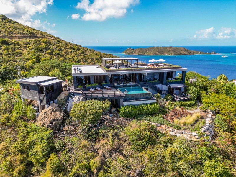 view of villa with sea in the background