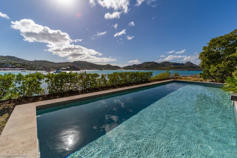 pool with sea in the background