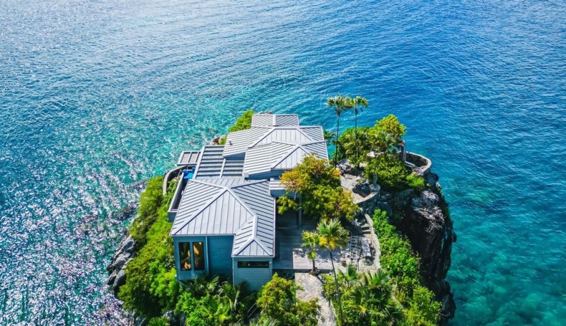 View of villa with ocean behind