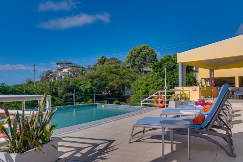 View of Pool with sea in the background
