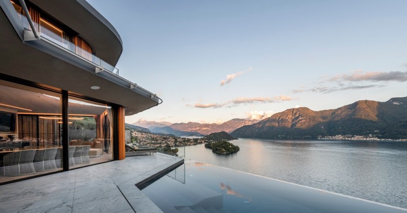 pool with lake como in the background