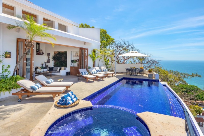 View of Pool with sea in the background