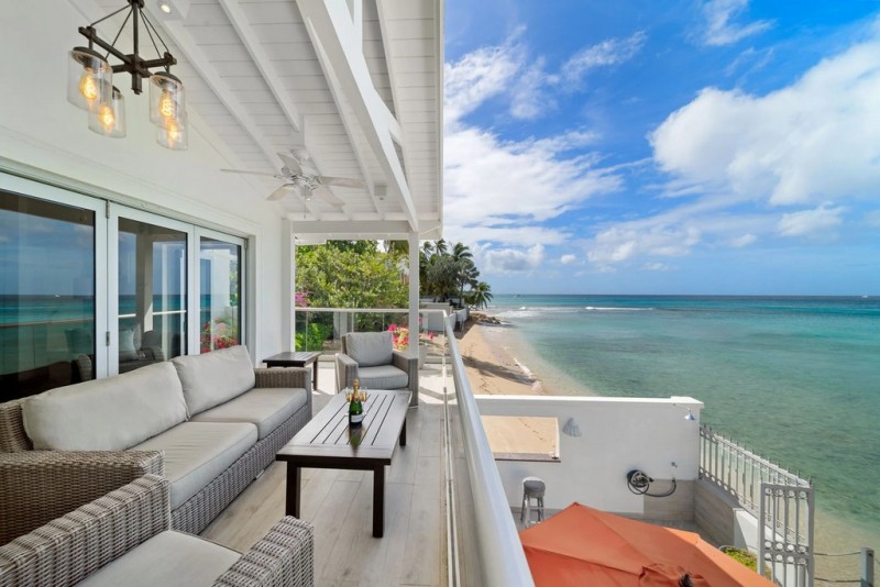 View of balcony with ocean in the background